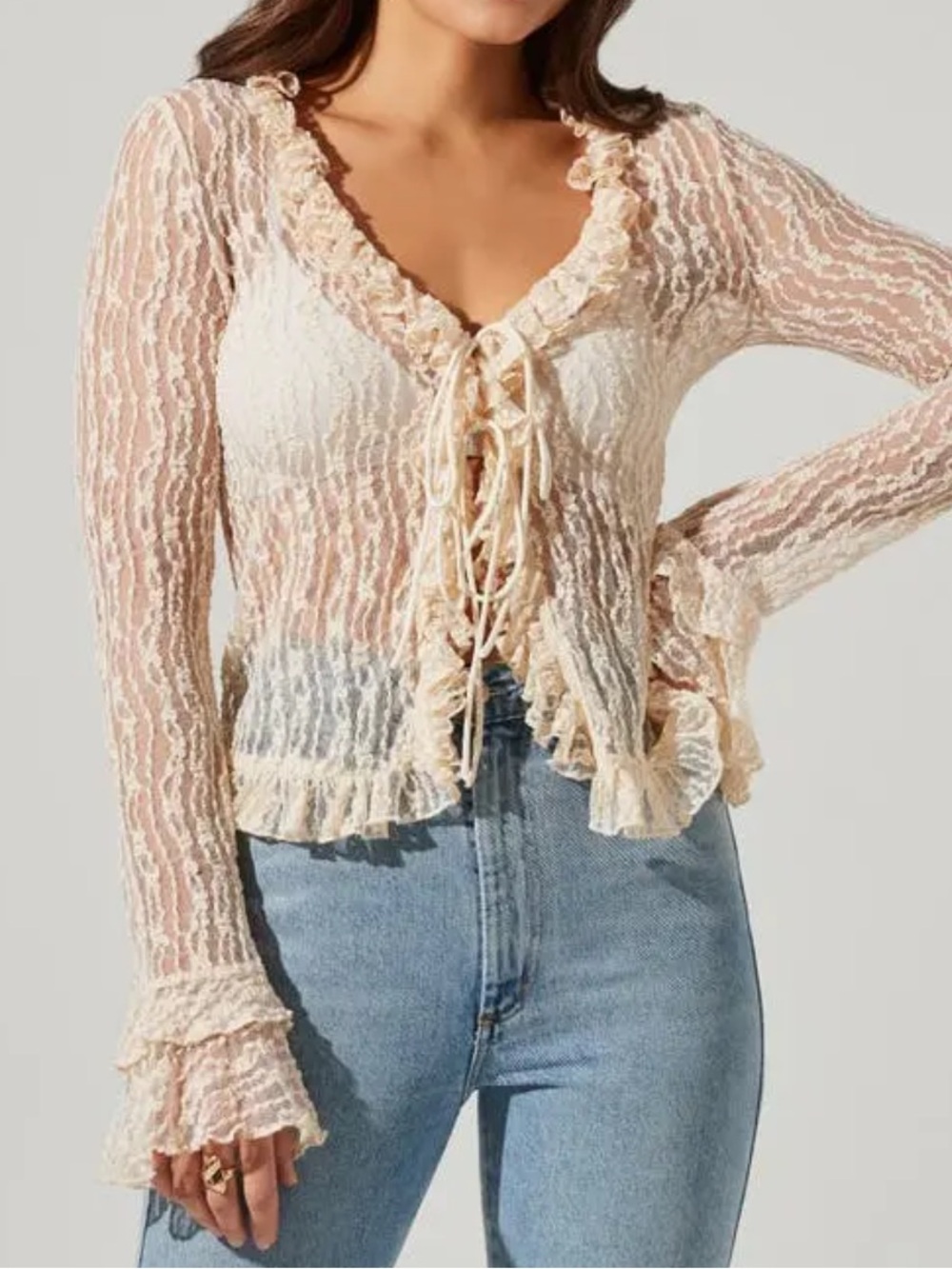 Astr Sheer Ruffle Lace-Up Blouse in Cream